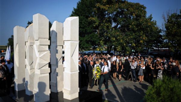 Relatives and officials pay respect on July 18, 2013 to a memorial dedicated to the five Israeli and one Bulgarian victims of a suicide blast which targeted on July 18, 2012 a bus of Israeli tourists at Burgas airport, southeast Bulgaria. A year after, Bulgaria is struggling to identify the attacker or confirm his suspected links to Hezbollah or Iran. (NIKOLAY DOYCHINOV/AFP/Getty Images)