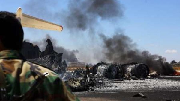 The remains of a burnt airplane seen at the Tripoli International Airport in Libya on July 16, 2014. (AFP/Mahmud Turkia)