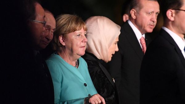 German Chancellor Angela Merkel (3rd L), Russia's President Vladimir Putin (2nd L), and Turkey's President Recep Tayyip Erdogan (R) are seen as G20 leaders and their spouses walk for a group picture prior to a dinner banquet at the G20 Summit in Hangzhou on September 4, 2016. (AFP/Johannes Eisele)