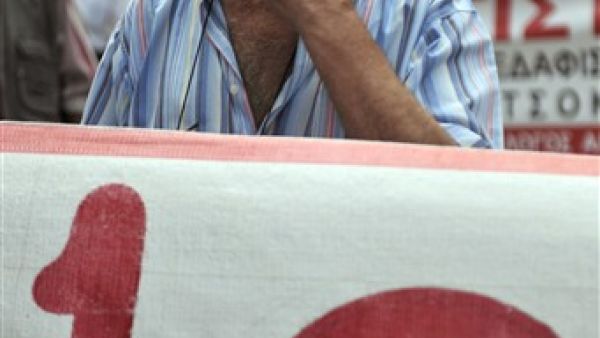 GREECE, Athens : A Greek pensioner demonstrates in front of the Health Ministry and social insurance office in the center of Athens on June 9, 2010 against austerity measures and pension cuts.