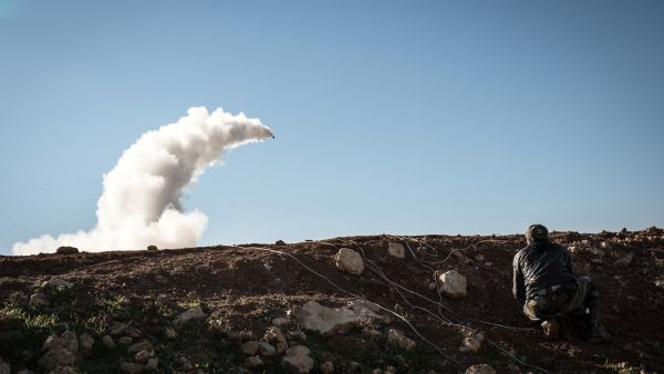 Syrian rebels launch a missile near the Abu Baker brigade in Albab, 30 kilometres from the northeastern Syrian city of Aleppo, on Wednesday. 