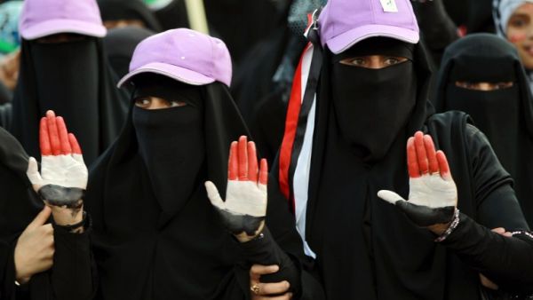 Women, whose hands are painted with Yemen's colours, take part in a rally marking the first anniversary of the ouster of autocratic leader Ali Abdullah Saleh. (AFP PHOTO/ MOHAMMED HUWAIS)
