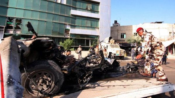 An Iraqi soldier loads the wreckage of a car bomb from the shrine city of Karbala, southwest Baghdad, on Thursday, the deadliest day for Iraq in more than two months. (AFP PHOTO)
