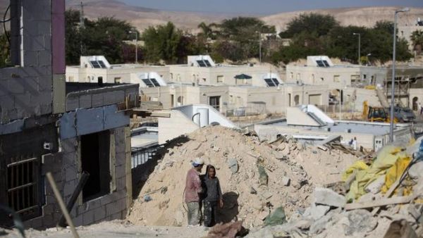 Palestinians laborers work at a housing construction site in the West Bank settlement of Alon, east of Jerusalem on Monday (AFP PHOTO/MENAHEM KAHANA)