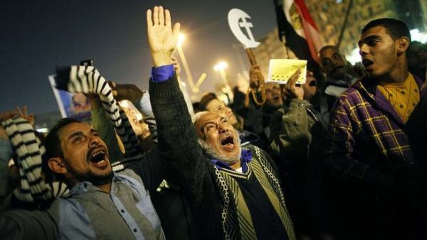 An Egyptian opposition supporter shouts political slogans as hundreds of protesters demonstrated against President Mohammed Morsi in Cairo's landmark Tahrir square on Tuesday. (AFP PHOTO/MAHMOUD KHALED)