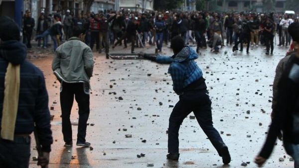 Egyptian opponents and supporters of President Morsi clash in Alexandria on Thursday. (AFP)