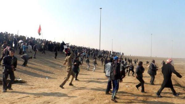 Iraqis throw stones after protestors attacked Iraq's deputy prime minister Saleh al-Mutlak on Sunday. (AFP)