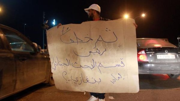 Libyan policemen in civilian clothing protest against the kidnapping of the Head of Criminal Investigation Department, Abdel Salam al-Mahdawi, outside the Tibesti hotel in Benghazi, on Thursday. (AFP PHOTO / ABDULLAH DOMA)