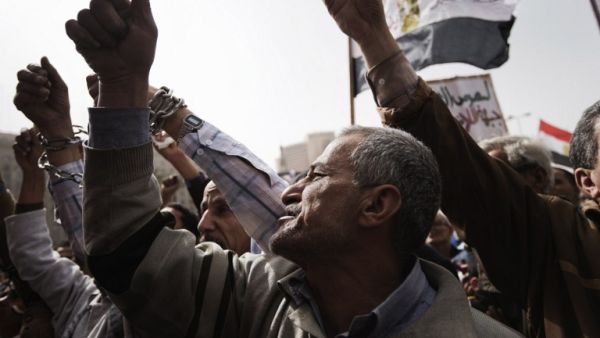 Egyptian anti-government protestors shout slogans against Egypt's President Mohamed Morsi during a demonstration in Cairo's landmark Tahrir square. (AFP PHOTO/GIANLUIGI GUERCIA)