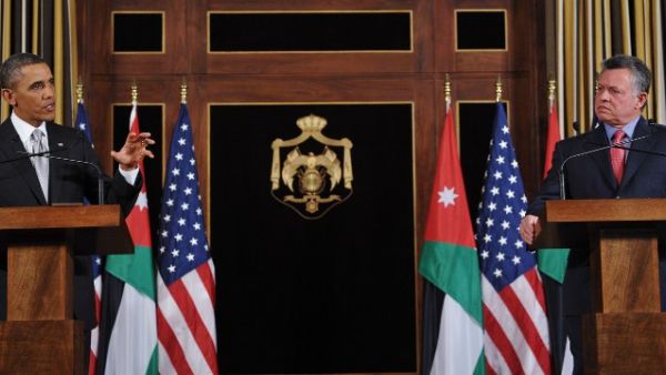 US President Barack Obama (L) speaks near Jordan's King Abdullah II during a joint press conference following a meeting at Al-Hummar Palace in Amman on March 22, 2013. Obama arrived in Jordan to face scrutiny over his Syria strategy, on the last leg of a Middle East tour after visits to Israel and the Palestinian territories. (AFP PHOTO/MANDEL NGAN)