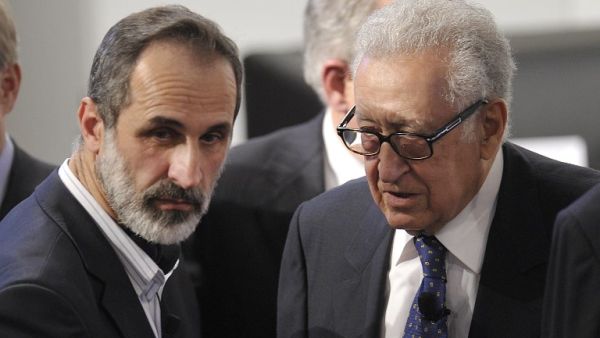 Lakhdar Brahimi (R), Joint Special Representative of the United Nations and the League of Arab States on Syria, talks with Sheikh Moaz Al-Khatib, head of the Syrian oposition during the Munich Security Conference. (AFP PHOTO / THOMAS KIENZLE)
