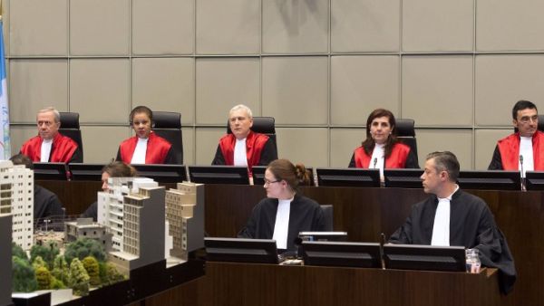 Four Hezbollah members went on trial in absentia at a UN-backed tribunal accused of murdering Hariri in a 2005 car bombing, with sectarian tensions running high at home. [AFP]