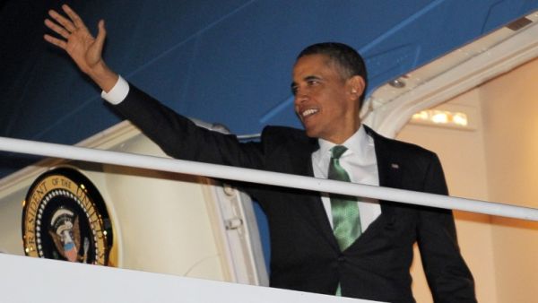 U.S. President Barack Obama makes his way to board Air Force One on Tuesday at Andrews Air Force Base in Maryland. (AFP PHOTO/Mandel NGAN)