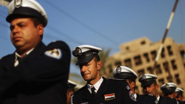 Iraqi police practice marching in preparation for ceremonies marking the departure of American troops last year in Baghdad. (Photo by Mario Tama/Getty Images)