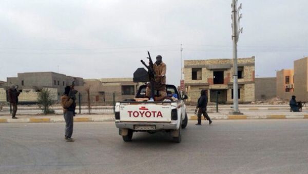 Armed men roam a street in the western, mainly Sunni Muslim city of Ramadi, the capital of the Anbar province, on January 4, 2014, as parts of Ramadi and the city of Fallujah. [Getty Images]