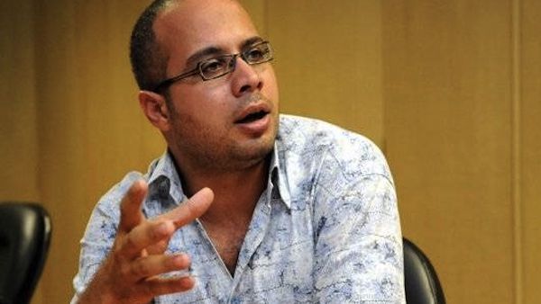 A key figure in the uprising against Hosni Mubarak in 2011, political activist Ahmad Maher turned himself into the Egyptian authorities late on Saturday after they issued a warrant for his arrest. (file