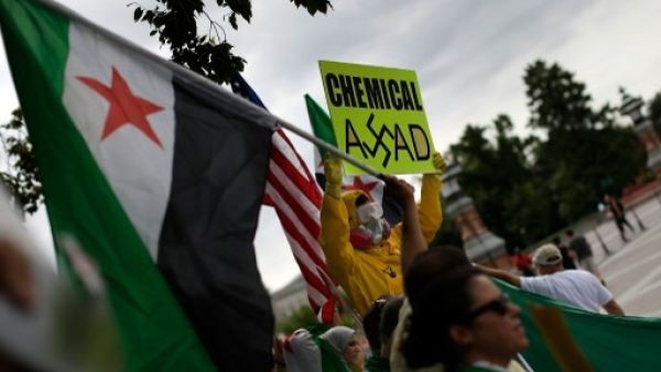 Syrian American protesters gather outside the US Capitol urging Congress to support US. President Barack Obama in striking Syria. Russia has come up with a proposal that will allow Syria to hand over its chemical weapons stockpiles to the US. (AFP)
