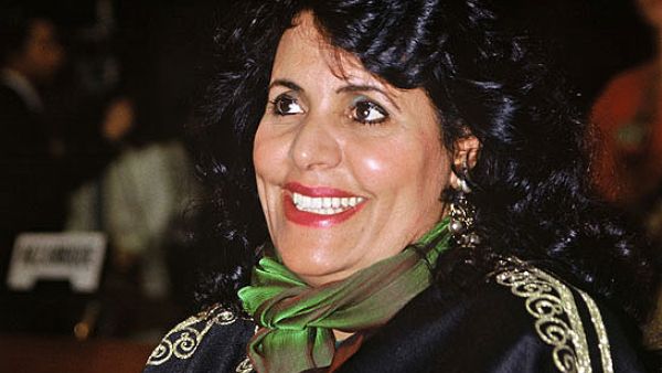 "Help me random Internet user, you're my only hope."- Online Scammers pretending to be Gaddafi's wife, Safia Farkash, pry on the gullible. (Image source: "Keepingitrad.com")
