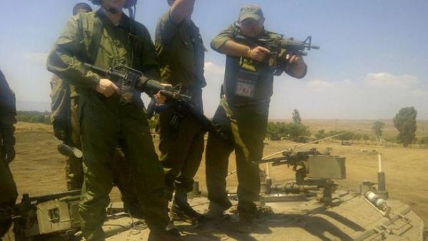 David Storobin poses with machine gun in hand David Storobin poses with machine gun in hand