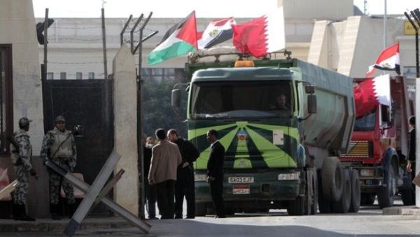 An Egyptian truck loaded with gravel prepares to enter through the Rafah border crossing, between Egypt and Gaza Strip, on Saturday. (AFP PHOTO / SAID KHATIB)