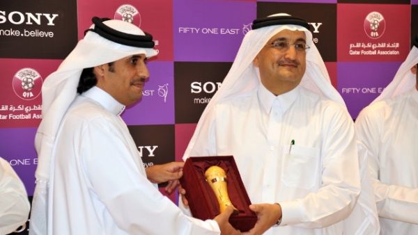 Mr. Khaled Al-Kuwari handing a miniature Emir's Cup to Mr. Bader as a token of QFA's appreciation Mr. Khaled Al-Kuwari handing a miniature Emir's Cup to Mr. Bader as a token of QFA's appreciation