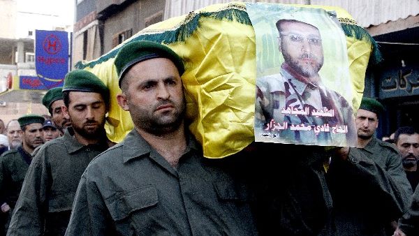 Members of Lebanon's Hezbollah carry the coffin of Fadi Mohammed al-Jazzar during his funeral in southern Beirut on Monday. AFP Photo