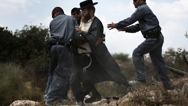 Extremist right-wing settlers from Yitzhar clashed with Israeli security forces over the destruction of illegally built homes. (AFP/File)
