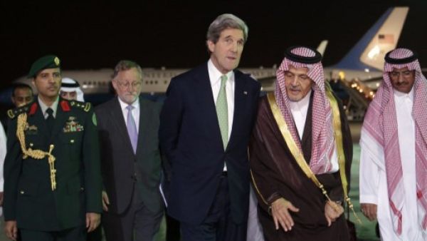 John Kerry is greeted by Saudi counterpart Prince Saud Al Faisal.