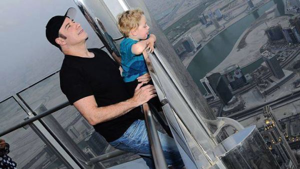John Travolta and son survey the Dubai view atop the observation deck at Burj Khalifa. (Image: Facebook)