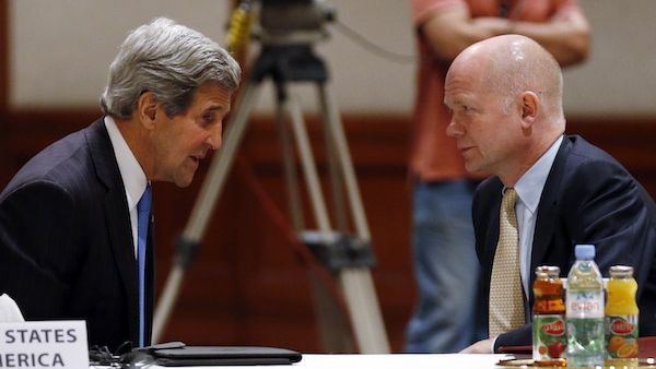 US Secretary of State John Kerry and British Foreign Secretary William Hague discuss Syria at the Friends of Syria meeting in Amman on Wednesday evening