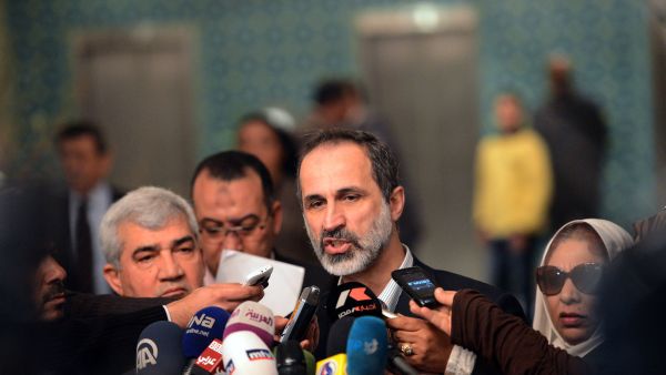 Ahmed Moaz al-Khatib, President of the National Coalition for Syrian Revolutionary and Opposition Forces, talks to the press following his meeting with Arab League Secretary General Nabil al-Arabi. (AFP)