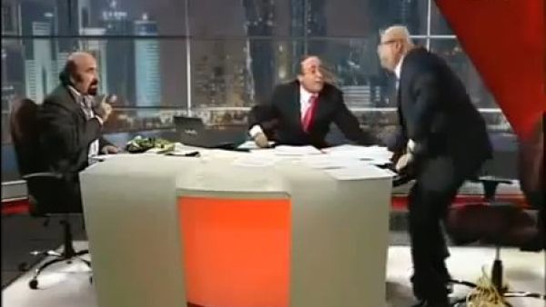 A still of the Al-Jazeera video that involves the altercation Lebanese pro-regime analyst Joseph Abu Fadel and Syrian opposition activist Muhieddine Ladkani on live television.