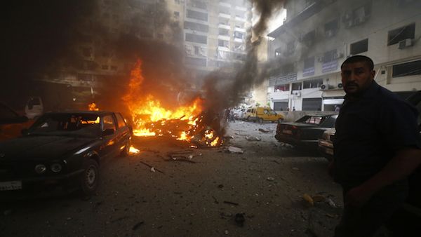 Residents gather at the site of an explosion in Beirut's southern suburb neighbourhood of Bir al-Abed on July 9, 2013. (Source AFP/STR)
