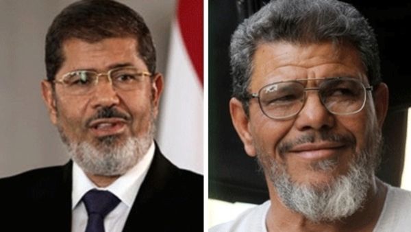 So close but yet so far: Security guards blocked a rendezvous between Egyptian President Mohamed Morsi (left) and his look-alike. 
