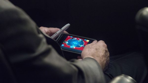 Papped! John McCain plays poker on his smartphone during a crucial Syria hearing (Photo courtesy: The Washington Post)