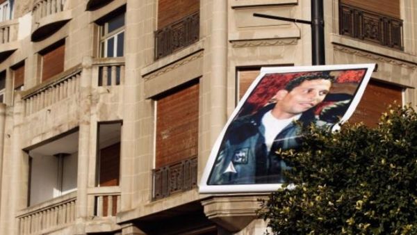 A photo of Mohamed Bouazizi floats about Avenue Bourghiba in Tunisia's capital.