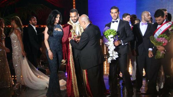 The moment Ayman Moussa was crowned as Mr. Lebanon alongside singer Haifa Wehbe. (Image: Facebook)