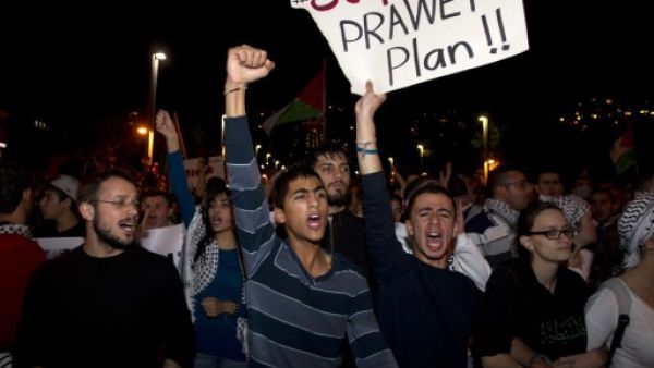 Arab-Israelis take part in a demonstration against the against the Prawer plan in the northern Israeli city of Haifa on November 30, 2013. The so-called Prawer-Begin Bill calls for the relocation of 30,000-40,000 Bedouin in the Negev - 80 percent of which support the law, according to Israeli official Dror Almog. (AFP)
 Arab-Israelis take part in a demonstration against the against the Prawer plan in the northern Israeli city of Haifa on November 30, 2013. The so-called Prawer-Begin Bill calls for the relocation of 30,000-40,000 Bedouin in the Negev - 80 percent of which support the law, according to Israeli official Dror Almog. (AFP)