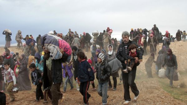 Amid fresh claims of a chemical weapons attack in the rebel-held town of Nabek on Friday, hundreds of Syrian refugees entered into Jordan this weekend. Here, refugees are seen entering Jordan via the northern border last week. (Photo courtesy of The Jordan Times/Nader Daoud)
