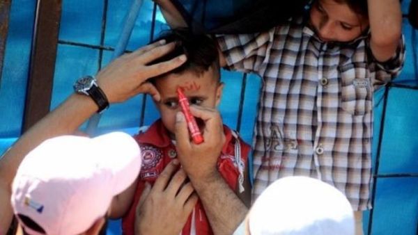Marked for protest: One way to identify Syrian refugees