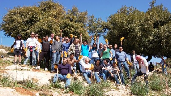Employees of Four Seasons Hotel Amman planting trees