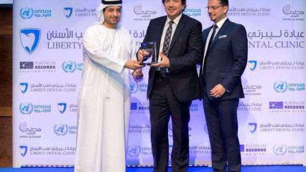UNRWA honors Walid Tawfiq with a plaque. (Image: Facebook)