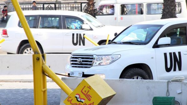 UN inspectors are seen arriving at the hotel in Damascus on August 26, 2013, following their return from an inspection of a suspected chemical weapons attack in Moadamiyet al-Sham. (AFP)