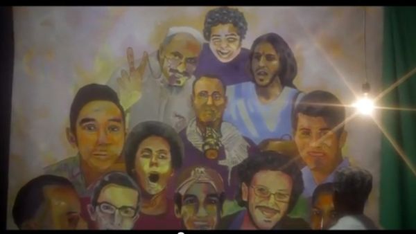 Screengrab of Al Masry showing a painting of the faces of several martyrs of the revolution