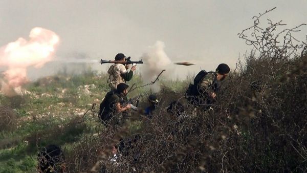 Over half the forces fighting against Syrian President Bashar Assad are hardline Islamists, a UK study said Monday. Here, rebels shoot at army positions on the outskirts of Aleppo. (AFP/File)