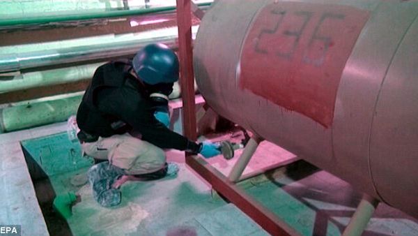 After inspecting 21 out of the 23 chemical production facilities, OPCW announced in a statement that it "is satisfied [it] has verified, and seen destroyed, all declared critical production/mixing/filling equipment [in Syria]" (EPA) 