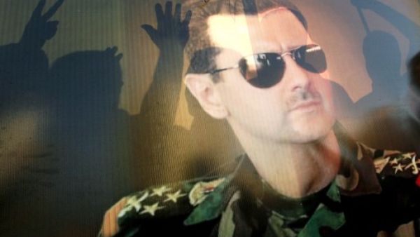 Supporters of Syrian President Bashar Assad rally during a demonstration against a possible US military strike on Syria in the Lebanese city of Sidon. (AFP)