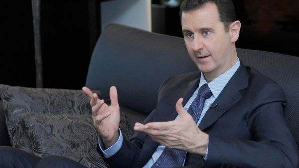 SYRIA, DAMASCUS : A handout picture released by the Syrian Arab News Agency (SANA) on August 26, 2013 shows Syrian President Bashar al-Assad giving an interview with Russian newspaper Izvestia in Damascus, during which he warned the United States of "failure" if it attacks Syria. AFP PHOTO / HO / SANA