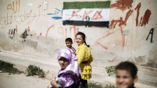 Children walk home from an improvised school in Azaz (AFP) Children walk home from an improvised school in Azaz (AFP)
