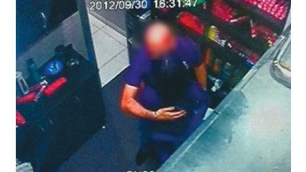 The defendants, though, told the court the kiss - captured on CCTV (pictured) - was just a birthday peck on the check.